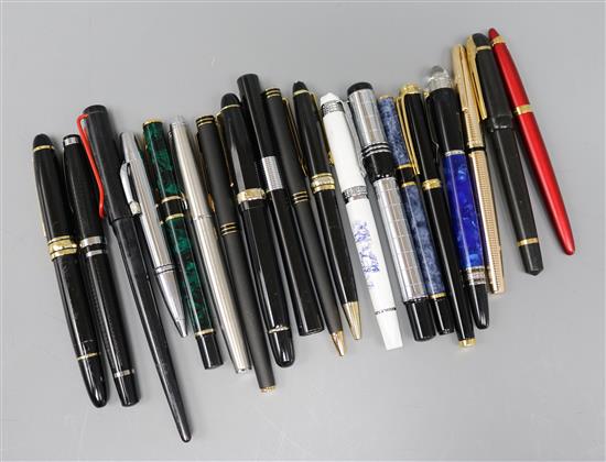 A collection of fountains pens, approximately nineteen